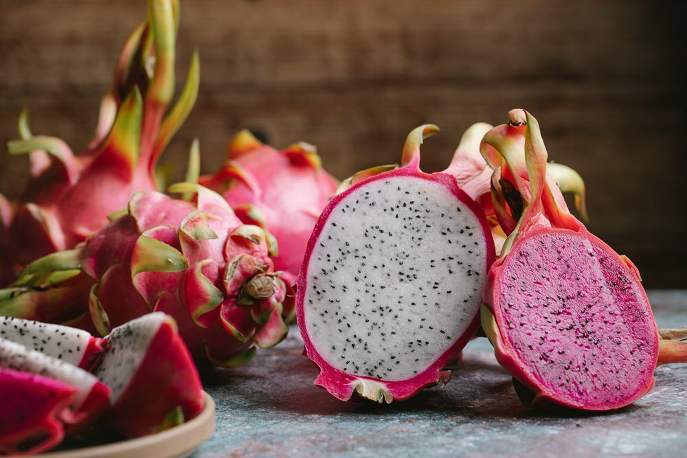 several dragon fruit on a counter