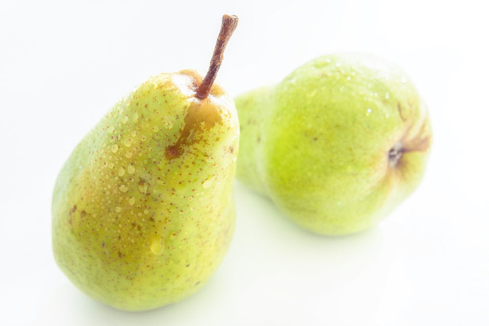 A close-up of a two pears